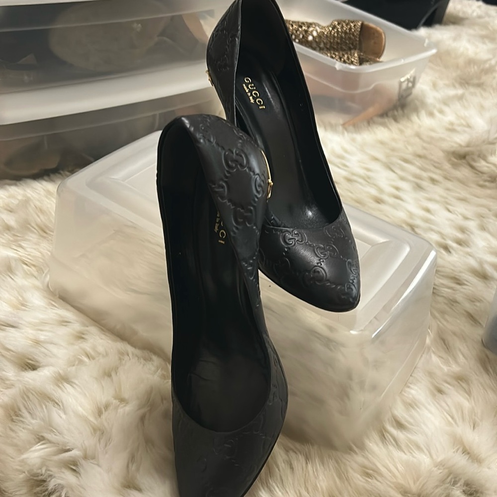 Black embossed Gucci heels